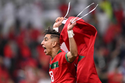Morocco's defender #18 Jawad El Yamiq celebrates winning the Qatar 2022 World Cup quarter-final football match between Morocco and Portugal at the Al-Thumama Stadium in Doha on December 10, 2022. (Photo by Kirill KUDRYAVTSEV / AFP)