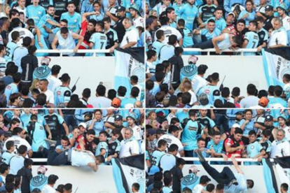 Balbo es arrojado al vacío por hinchas de Belgrano.-AFP