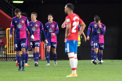 Real Valladolid's Portuguese midfielder Jota (R) celebrates with teammates after scoring a goal during the Spanish League football match between Granada FC and Real Valladolid FC at the Nuevo Los Carmenes stadium in Granada on November 22, 2020. (Photo by JORGE GUERRERO / AFP)