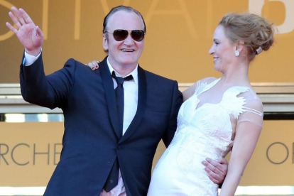Thurman y Tarantino, en Cannes, en mayo del 2004.-AFP / LOIC VENANCE