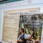 Un ordenador de la Biblioteca de Castilla y León muestra un ejemplar del periódico 'La Voz de la Bureba' ante el cartel de la película 'El maestro que prometió el mar', sobre la figura de Antonio Benaiges.