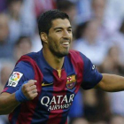 Luis Suárez celebra el gol de Neymar en el clásico.-Foto:   AP / PAUL WHITE