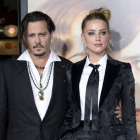 Johnny Depp y Amber Heard durante una premiere en Los Ángeles.-KEVORK DJANSEZIAN / REUTERS