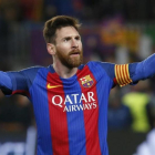 Messi celebra el pase del Barcelona a los cuartos de final de la Liga de Campeones.-AFP / PAU BARRENA