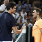 Raonic y Nadal se saludan tras el partido.-EFE