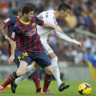 Leo Messi y Cristiano Ronaldo, durante un Barça-Madrid.-JORDI COTRINA