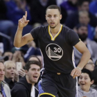 Stephen Curry celebra una canasta en el partido Warriors - Nets-MARCIO JOSE SANCHEZ