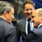 Draghi, Dijsselbloem y De Guindos, en el Eurogrupo.-Foto: AFP PHOTO / GEORGES GOBET