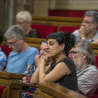 Los diputados de la CUP, en sus escaños del Parlament.-FERRAN SENDRA