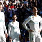 Bale, Nacho, Cristiano y Ramos lamentan la paliza que le infringió el Barça en el clásico.-REUTERS / PAUL HANNA