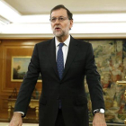 Rajoy, frente a un crucifijo, durante su toma de posesión como presidente, el pasado 31 de octubre en el palacio de la Zarzuela.-POOL / EFE