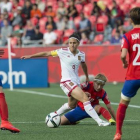 Vero Boquete, entre tres jugadoras de Corea del Sur.-Foto:   AFP PHOTO / NICHOLAS KAMM