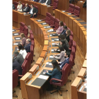 Los asesores en la bancada de Podemos.-E. M.