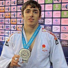 Gaitero con la medalla de plata-