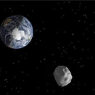 Imagen de una recreación distribuida por la NASA que representa el paso de un asteroide.-EFE