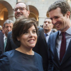 Soraya Sáenz de Santamaría, Pablo Casado y Javier Maroto (detrás), en los actos del Dos de Mayo. /-PARTIDO POPULAR