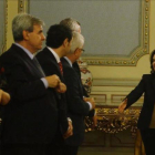 Santamaría y Montoro saludan a los consejeros autonómicos, este viernes en Madrid.-AGUSTÍN CATALÁN