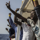 Algunos de los migrantes rescatados por la tripulación del Open Arms.-AP