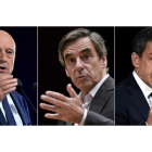 Los tres grandes favoritos en las primarias de la derecha francesa: Juppé (derecha), Fillon (centro) y Sarkozy.-AFP / LOIC VENANCE