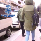 Uno de los detenidos, a la derecha, tras el registro de su casa en Valladolid. / E. M,.