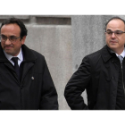 Jordi Turull (a la derecha), con Josep Rull, el pasado marzo, cuando fueron a declarar al Tribunal Supremo. /-AFP