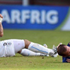 Suárez y Chiellini, tras el incidente del mordisco en el Mundial de Brasil.-Foto: AFP / JAVIER SORIANO