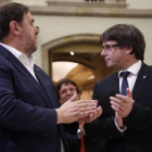 Oriol Junqueras y el president Puigdemont tras el pleno.-JULIO CARBÓ