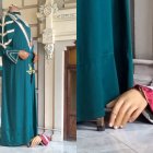 Imagen de la figura del gigante del Rey Fernando sin cabeza y la mano de la figura de la Reina Isabel.