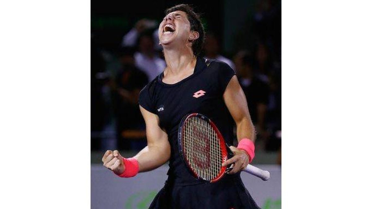 Carla Suárez, eufórica tras batir a Venus Williams en cuartos de final del torneo de Miami.-Foto: AFP / AL BELLO