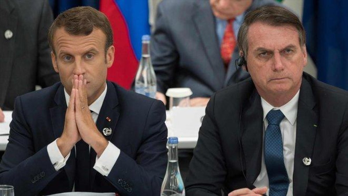 Macron y Bolsonaro chocan por los incendios en el Amazonas.-JACQUES WITT / POOL / AFP