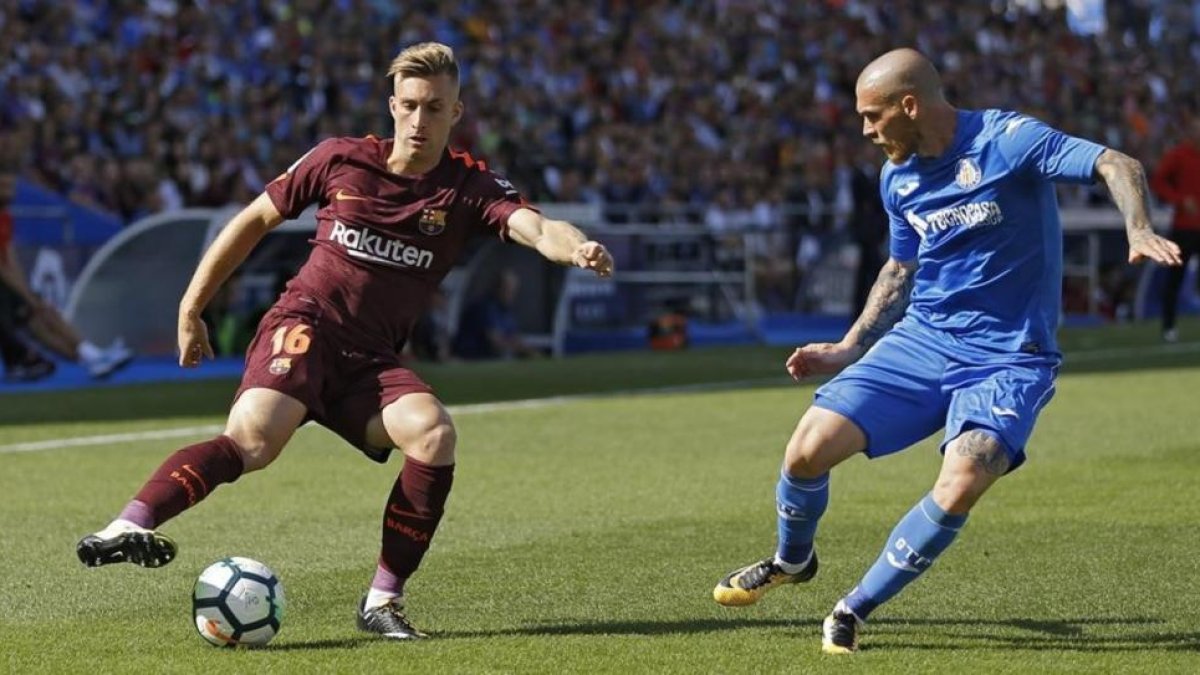 Deulofeu, durante una acción en campo del Getafe.-AP / FRANCISCO SECO
