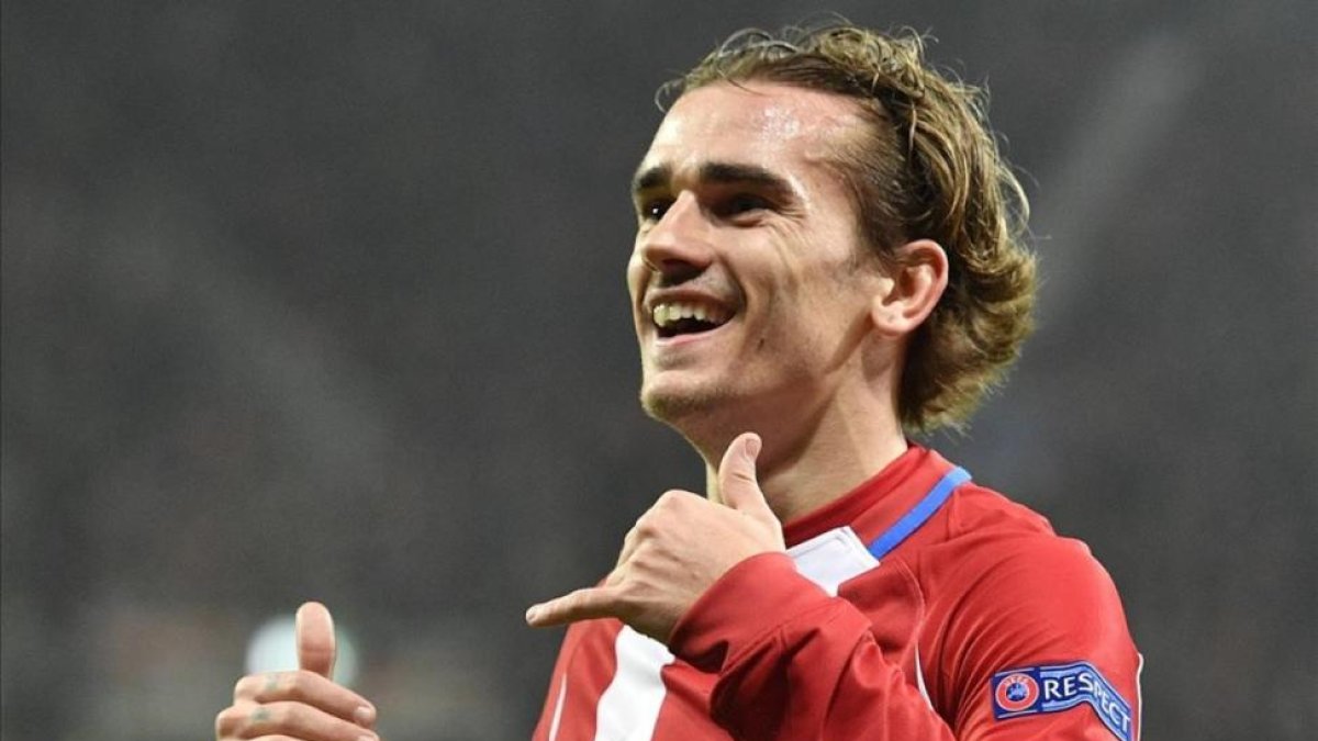 Griezmann celebra un gol en el encuentro de Champions ante el Bayer Leverkusen.-AP / MARTIN MEISSNER