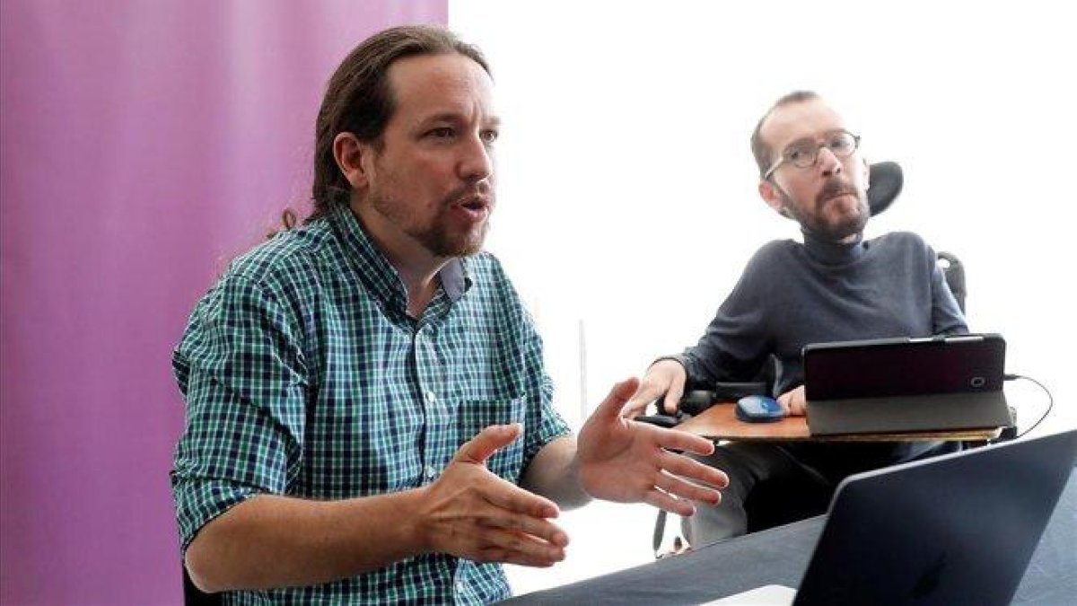 Pablo Iglesias y Pablo Echenique, durante la reunión interna de Unidas Podemos, este sábado.-EFE/ CHEMA MOYA
