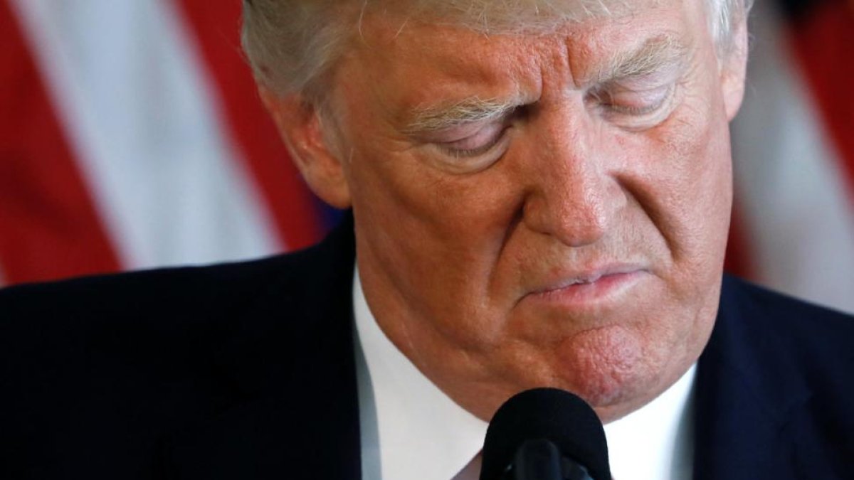 Comparecencia del presidente Donald Trump condenando los hechos de Charlottesville.-JONATHAN ERNST (REUTERS)