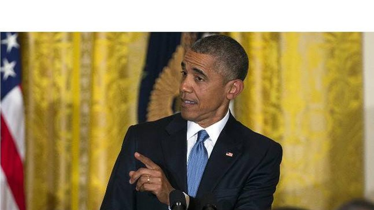 Obama, contestando a la activista en la recepción en la Casa Blanca-Foto: AP / EVAN VUCCI
