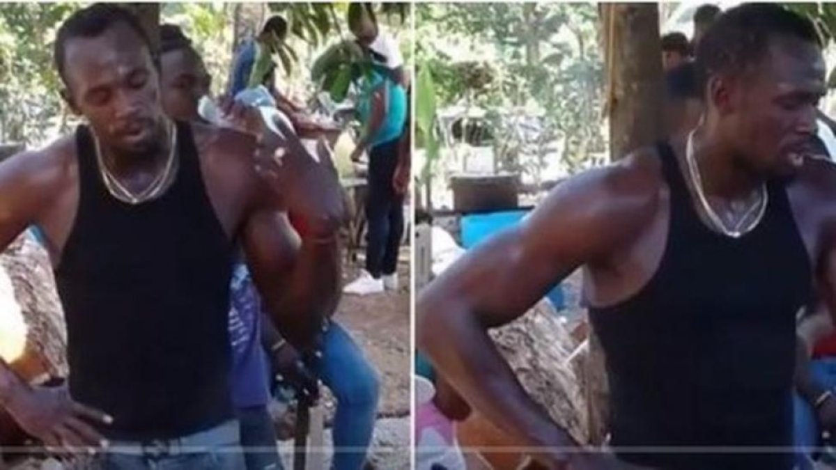 Usain Bolt, en un momento de reposo del esfuerzo de cavar la tumba de su amigo Mason.-