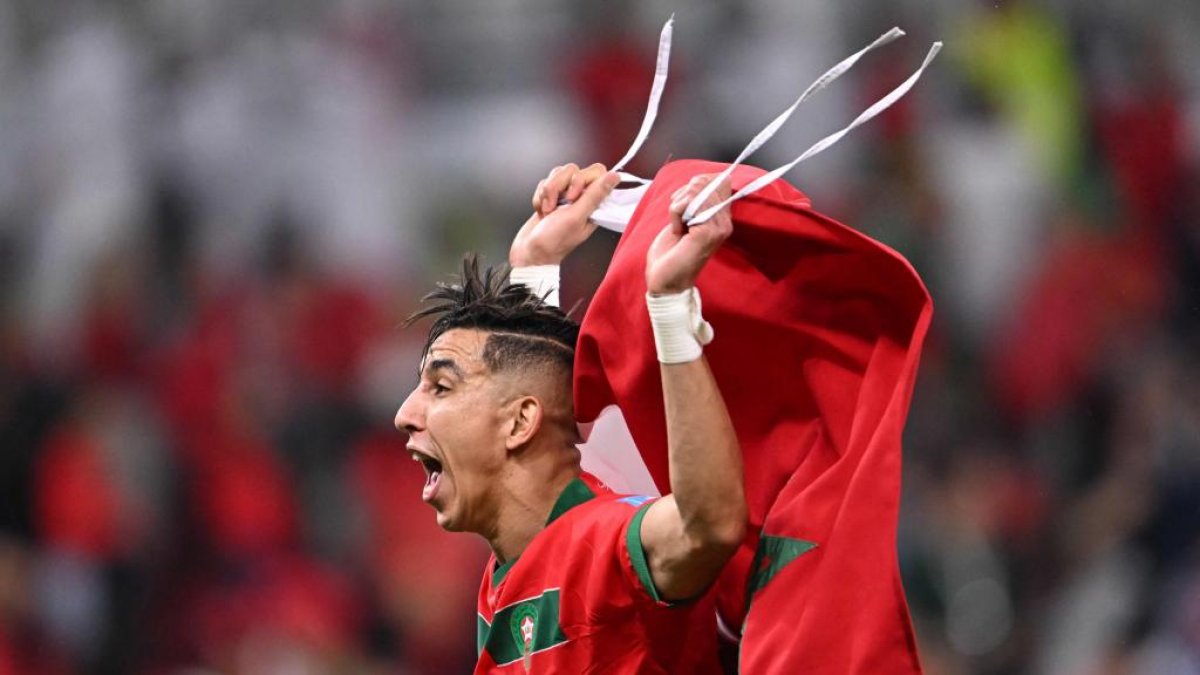 Morocco's defender #18 Jawad El Yamiq celebrates winning the Qatar 2022 World Cup quarter-final football match between Morocco and Portugal at the Al-Thumama Stadium in Doha on December 10, 2022. (Photo by Kirill KUDRYAVTSEV / AFP)