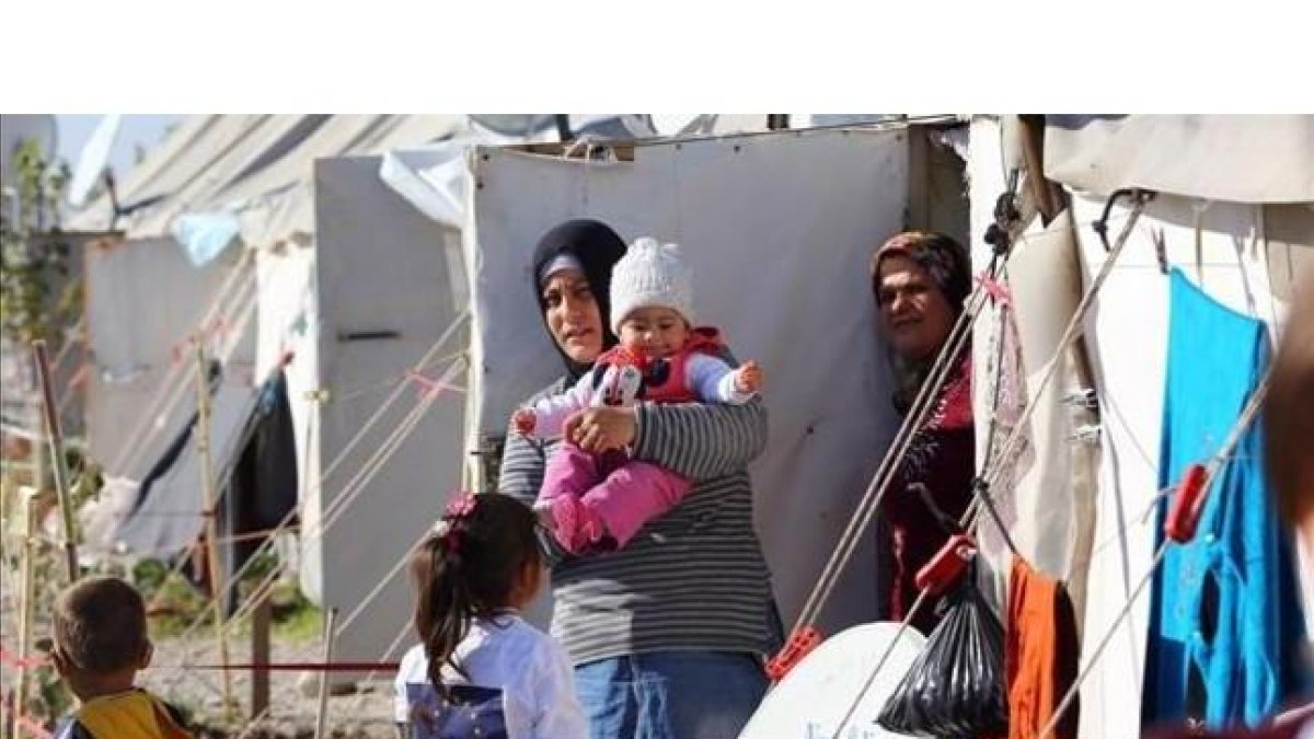 Refugiados sirios en un campo de refugiados de Osmaniye (Turquía), el 15 de diciembre.-AFP / ADEM ALTAN