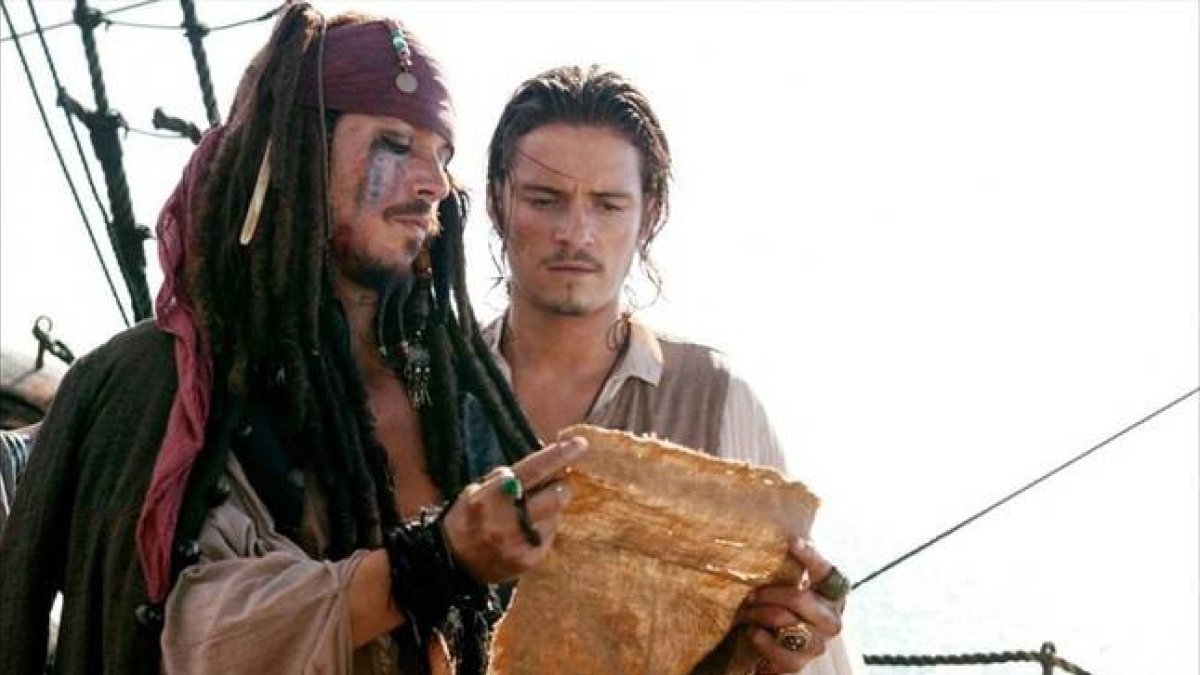 Johnny Depp y Orlando Bloom protagonizan  la segunda entrega de 'Piratas del caribe' .-