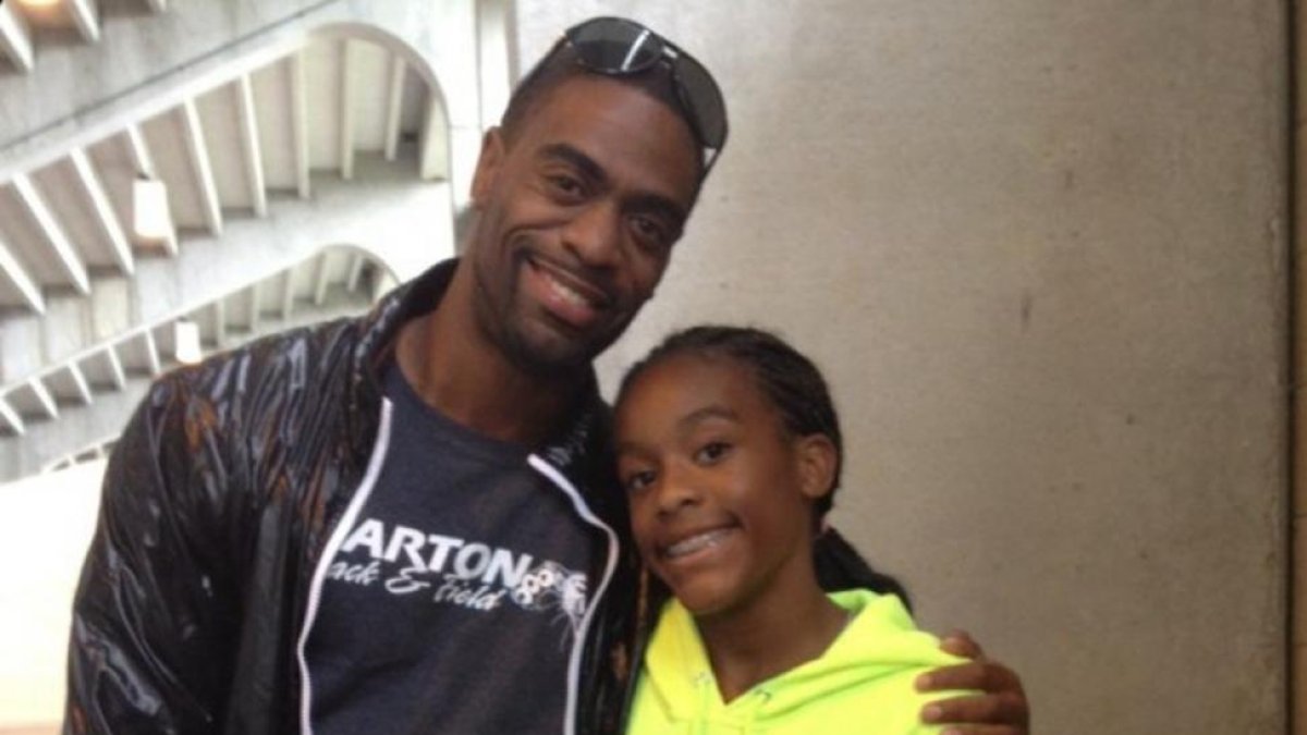 El atleta Tyson Gay y su hija, Trinity.-