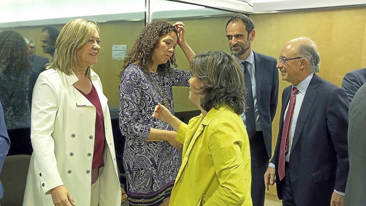 Pilar del Olmo, Soraya Sáenz de Santamaría y Cristóbal Montoro, en el último CPFF del jueves pasado.-ICAL