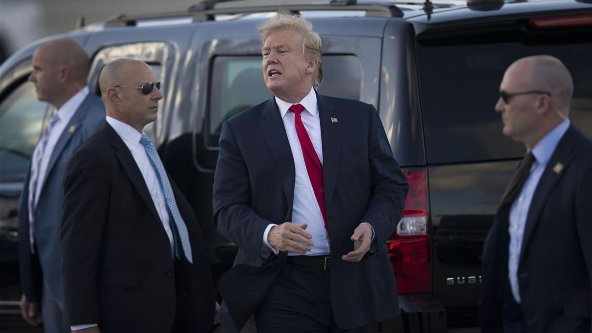 Trump a su llegada a Florida para pasar la Semana Santa.-AFP / JOE RAEDLE