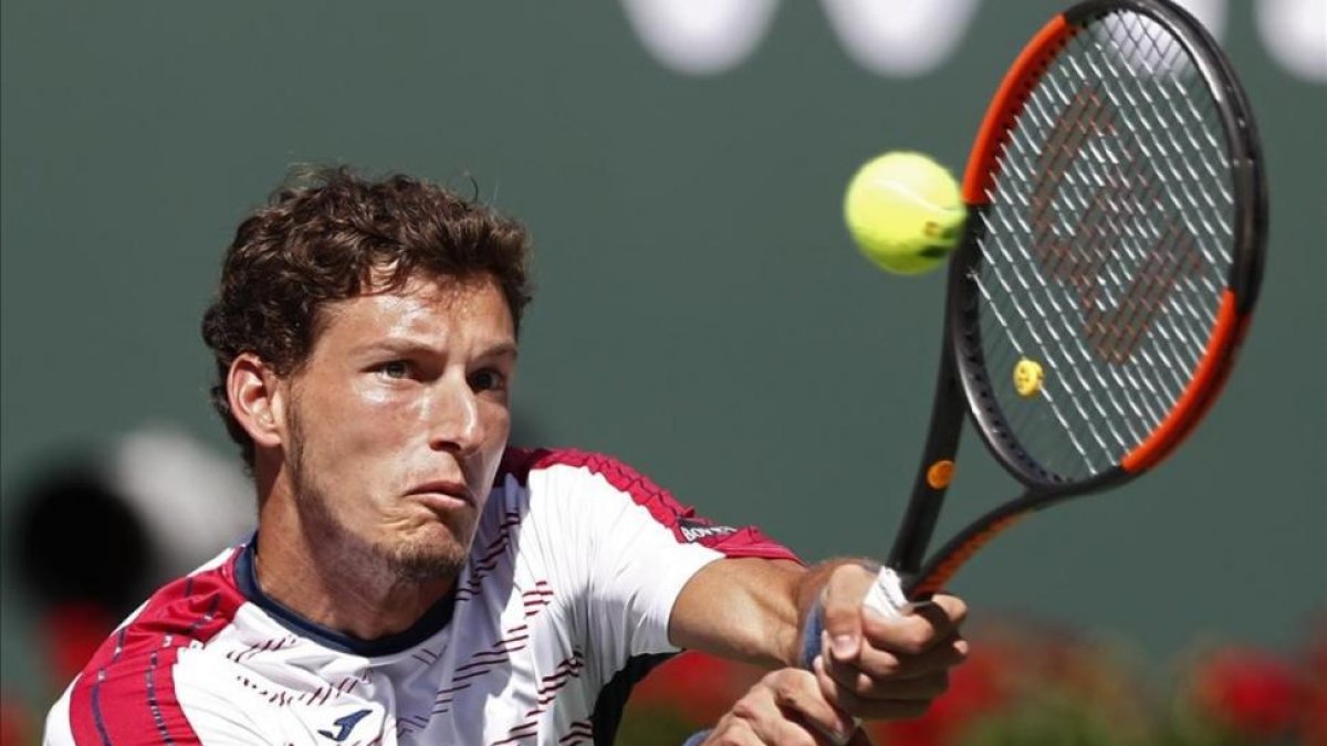 Pablo Carreño devuelve un golpe en la semifinal con Wawrinka.-EFE