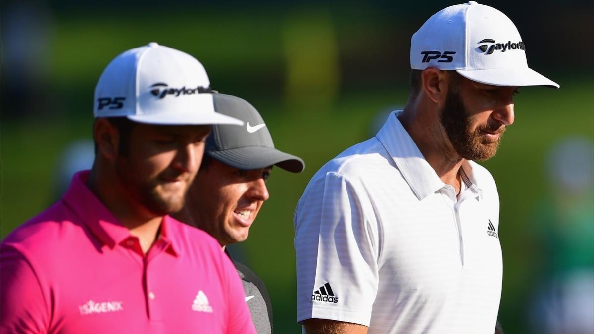 Jon Rahm, Rory McIlroy y Duston Johnson, en un entrenamiento en el campo del PGA Championship. /-AFP / STUART FRANKLIN