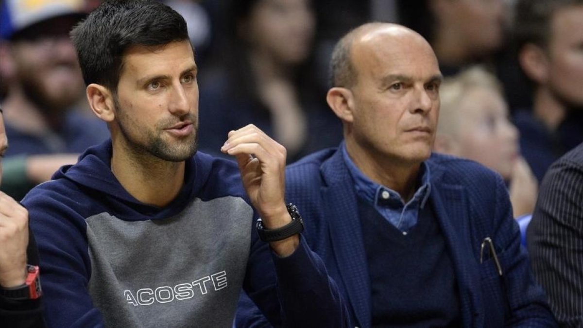 Djokovic, de espectador, en un reciente partido de la NBA.-USA TODAY / GARY A. VASQUEZ