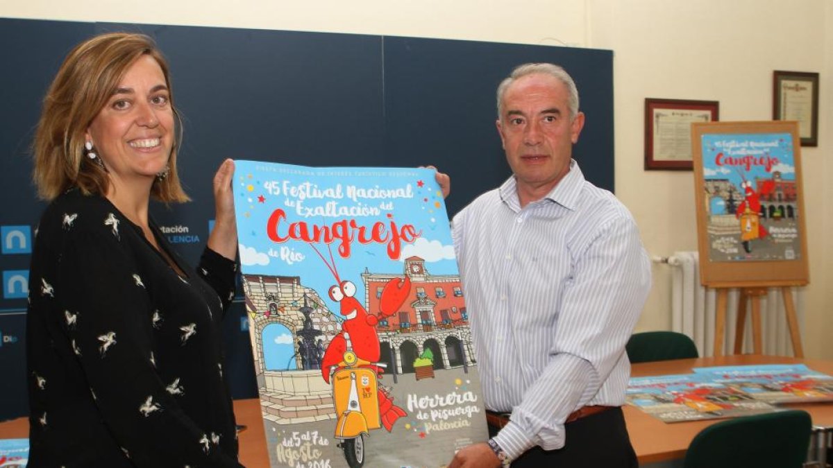 La presidenta de la Diputación, Ángeles Armisén, presenta junto al diputado provincial y alcalde de Herrera de Pisuerga, Javier San Millán, el 45 Festival de Exaltación del Cangrejo de Río de la localidad.-ICAL