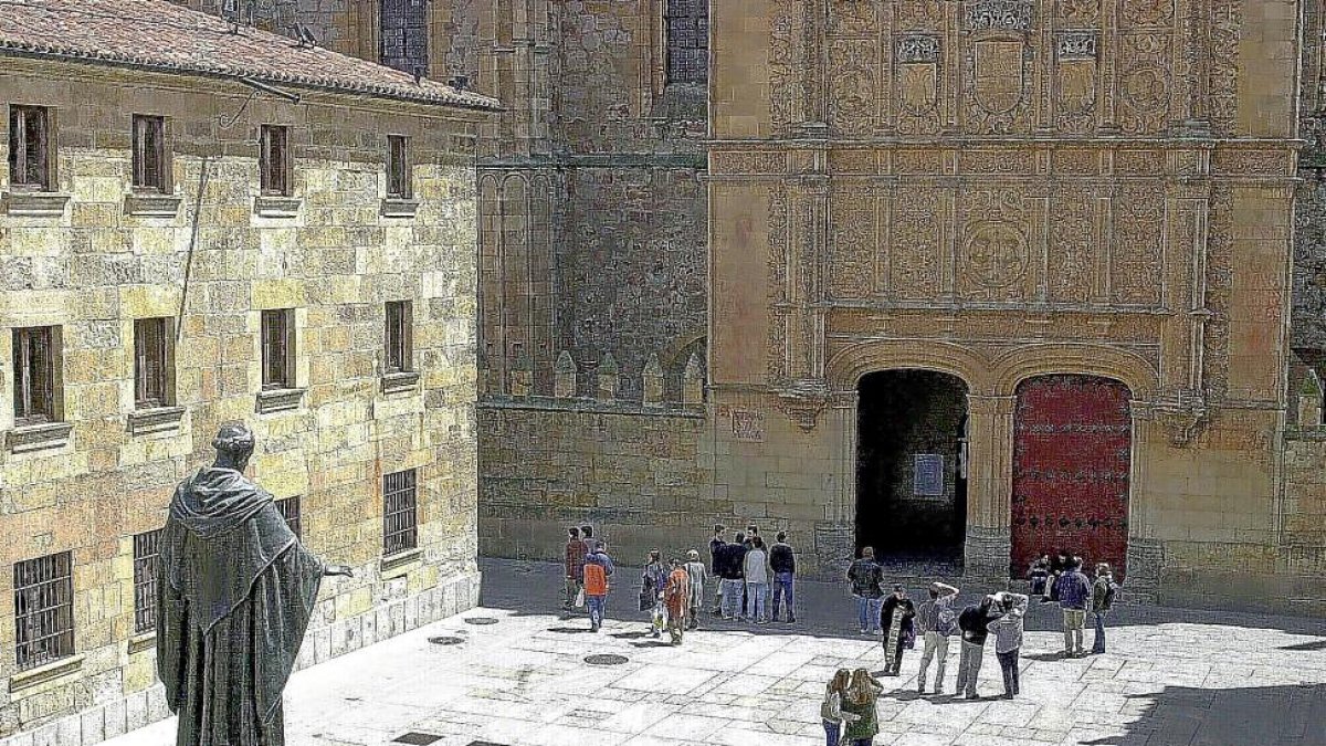 Los turistas buscan la célebre rana mientras contemplan la fachada histórica de la Universidad de Salamanca.-ICAL