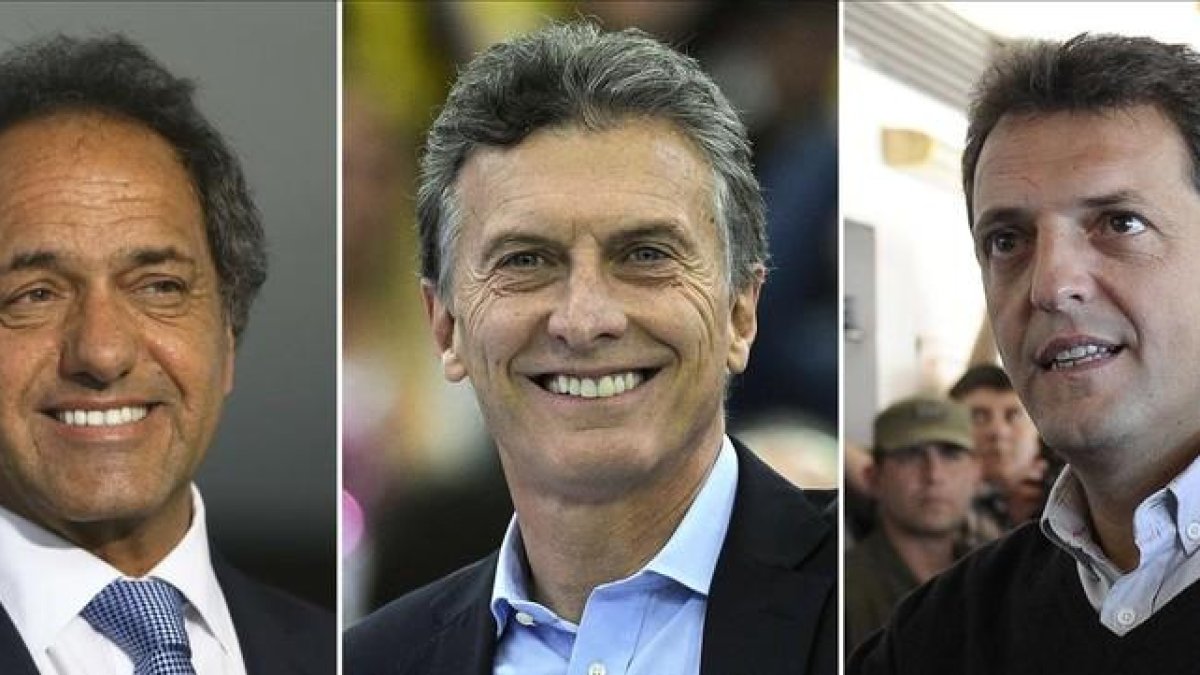 Combo de imágenes de tres de los favoritos. De izquierda a derecha: Scioli, Macri y Massa.-AFP