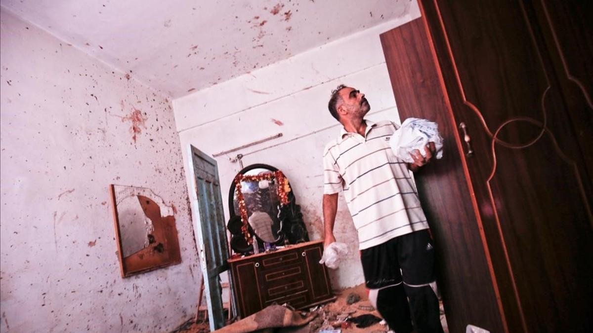 Los restos de la casa donde la palestina embarazada y su hija de 18 meses murieron por un misil israelí.-SAID KHATIB (AFP)