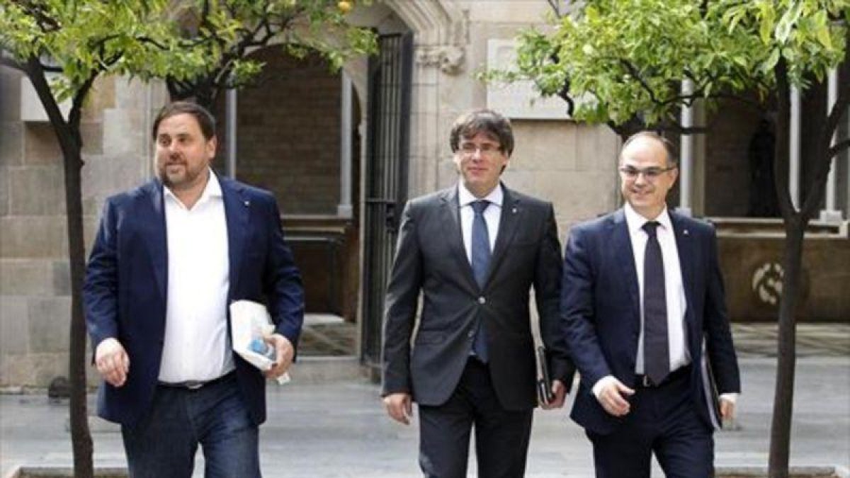 Junqueras, Puigdemont y Turull, el 1 de agosto.-RICARD CUGAT